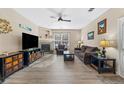 Comfortable living room features a fireplace, new flooring, and natural lighting at 4084 S Crystal Cir # 104, Aurora, CO 80014