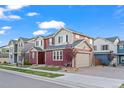 Attractive two-story home with a garage and manicured landscaping enhances community appeal and value at 10185 Xanadu St, Commerce City, CO 80022