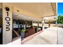 Building entrance featuring glass doors and brick flooring with potted plants at 1035 Colorado Blvd # 405, Denver, CO 80206