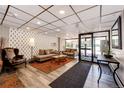 Cozy lobby with sofas, chairs, a patterned accent wall, and bright lighting at 1035 Colorado Blvd # 405, Denver, CO 80206