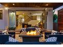Relaxing outdoor patio with a cozy fire pit, comfortable seating, and seamless indoor-outdoor living at 2658 Wolff St, Denver, CO 80212