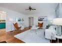 Bright living room features hardwood floors, modern decor, and stylish furniture at 1235 S Zenobia St, Denver, CO 80219
