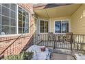 Small patio with table and chairs, partially covered at 13791 E Lehigh Ave # A, Aurora, CO 80014