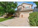 Charming two-story home with a well-maintained lawn, mature tree and a two car garage at 13486 Clayton St, Thornton, CO 80241
