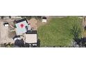 An aerial view shows the property with an expansive green lawn and multiple outbuildings at 1020 Kipling St, Lakewood, CO 80215