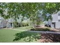 Exterior features green space, landscaping, and walking path at 11115 E Alameda Ave # 201, Aurora, CO 80012