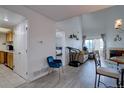 Bright living room showcasing the open layout, fireplace, and access to the balcony at 11115 E Alameda Ave # 201, Aurora, CO 80012