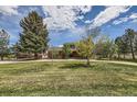 Beautiful home with mature trees and landscaping, spacious front yard and winding driveway at 6646 S Fundy Ct, Centennial, CO 80016