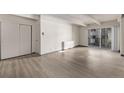 Bright and airy living room with access to a balcony, complemented by sleek flooring at 1265 Race St # 208, Denver, CO 80206