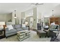 Spacious living room with comfortable seating and seamless flow into other areas of the home at 292 Summerwood Ln, Castle Pines, CO 80108