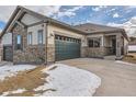 Craftsman style home with stone accents, two-car garage, and covered entry at 804 W 128Th Pl, Westminster, CO 80234