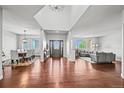 An open and bright foyer featuring wood floors and views of the dining and living areas at 188 S Rogers Way, Golden, CO 80401