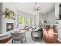 A modern living room features a fireplace, vaulted ceilings, and large windows with mountain views at 188 S Rogers Way, Golden, CO 80401