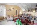 Cozy living room with vaulted ceilings and neutral decor at 4621 S Perry Way, Denver, CO 80236