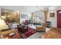 Inviting living room featuring a bay window, comfortable seating, and an open layout at 4621 S Perry Way, Denver, CO 80236