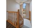 Bright entryway featuring staircase, large window, and stylish pendant light at 7082 Silverhorn Dr, Evergreen, CO 80439
