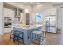 Modern kitchen featuring granite countertops, stainless steel appliances, a spacious island, and stylish pendant lighting at 670 Portland Rd, Monument, CO 80132