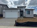 A charming single-story home featuring a two-car garage and stone accents on the facade at 2141 S Irvington St, Aurora, CO 80018