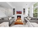 Bright living room with a fireplace, stylish decor, and hardwood floors providing a modern look at 2950 E 17Th Ave, Denver, CO 80206