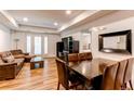 Open floor plan features a comfortable living room, dining area, and access to a private patio at 2200 S University Blvd # 212, Denver, CO 80210