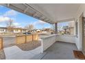 Inviting front porch with a concrete floor and a partial privacy wall, perfect for relaxing outdoors at 5123 Milwaukee St, Denver, CO 80216