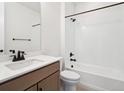 Clean bathroom featuring a bathtub, shower, and modern vanity at 3826 N Elk St, Aurora, CO 80019