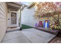 Inviting front porch with outdoor seating, and seasonal decor at 2067 E Phillips Pl, Centennial, CO 80122