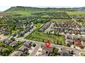 Wide aerial view of a neighborhood with mountain views showcasing community and surrounding landscape at 6013 Eldora St, Golden, CO 80403