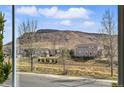 Scenic mountain views are visible from the window of this lovely property at 6013 Eldora St, Golden, CO 80403