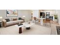 A comfortable living room with modern furniture and a stylish kitchen area in the background at 585 S Alton Way # 6B, Denver, CO 80247