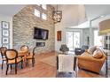 Inviting living room featuring a stone accent wall, fireplace, and stylish furnishings at 4514 W 34Th Ave, Denver, CO 80212