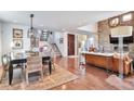 Spacious living and dining area with hardwood floors and open floor plan at 4514 W 34Th Ave, Denver, CO 80212