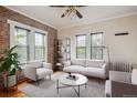Inviting living room showcasing exposed brick, natural light, and stylish furniture at 1351 N Washington St # 23, Denver, CO 80203