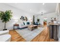 Bright living room with hardwood floors, white walls, stylish decor, and natural light at 1375 Perry St, Denver, CO 80204