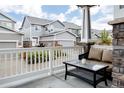 Cozy back patio area with outdoor furniture and a view of the surrounding neighborhood at 640 E Fremont Pl, Littleton, CO 80122