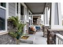 Inviting front porch with comfortable seating, perfect for relaxing outdoors at 640 E Fremont Pl, Littleton, CO 80122