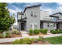 Contemporary gray home with well-manicured front yard and clearly visible 'For Rent' sign at 16203 E 47Th Pl, Denver, CO 80239