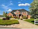 Two-story home with a large front yard and driveway at 221 Mulligan Lake Dr, Mead, CO 80542