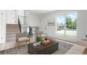 Inviting living area with a large window, comfortable chairs, and stylish decor; staircase visible at 16322 E Idaho Pl, Aurora, CO 80017