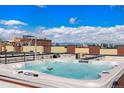 Rooftop jacuzzi with city views and blue sky at 2335 Walnut St # 10, Denver, CO 80205