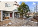 Charming townhome exterior with a welcoming front porch and attractive landscaping at 23500 E Alamo Pl # B19, Aurora, CO 80016