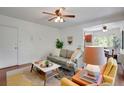 Comfortable living room with hardwood floors, neutral decor, and lots of natural light at 1201 Race St # 10, Denver, CO 80206