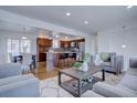 Open concept kitchen with granite island and stainless steel appliances at 12866 E Ohio Ave, Aurora, CO 80012