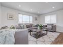 Bright living room featuring hardwood floors and comfy seating at 12866 E Ohio Ave, Aurora, CO 80012
