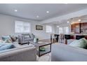 Open concept living room with kitchen and dining area views at 12866 E Ohio Ave, Aurora, CO 80012
