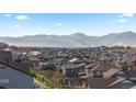 Picturesque neighborhood view with rolling hills and mountain backdrop at 17213 W 93Rd Pl, Arvada, CO 80007