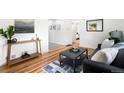 Cozy living room with modern furnishings and hardwood floors at 1180 Newark St, Aurora, CO 80010