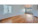 Spacious living room with hardwood floors and large windows at 20521 E Bellewood Pl, Aurora, CO 80015