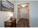 Bright entryway with wood-look floors and white shiplap walls at 23579 E Swallow Cir, Aurora, CO 80016