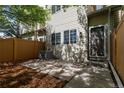 Townhouse backyard with private patio, lawn, new fence, and natural light at 12558 E Tennessee Cir, Aurora, CO 80012